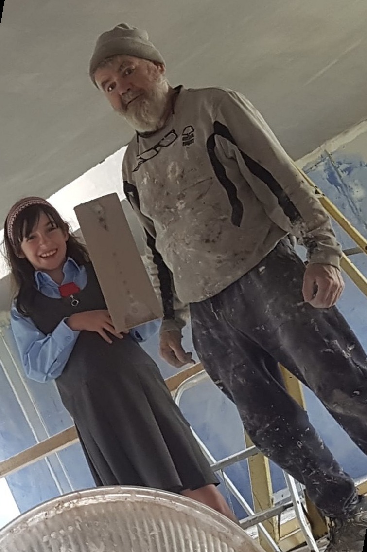 Denis Sr. and his granddaughter